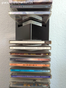 Diverse CD's und CD- Ständer. Diverse CD's und CD- Ständer gemäss Fotos zu verschenken