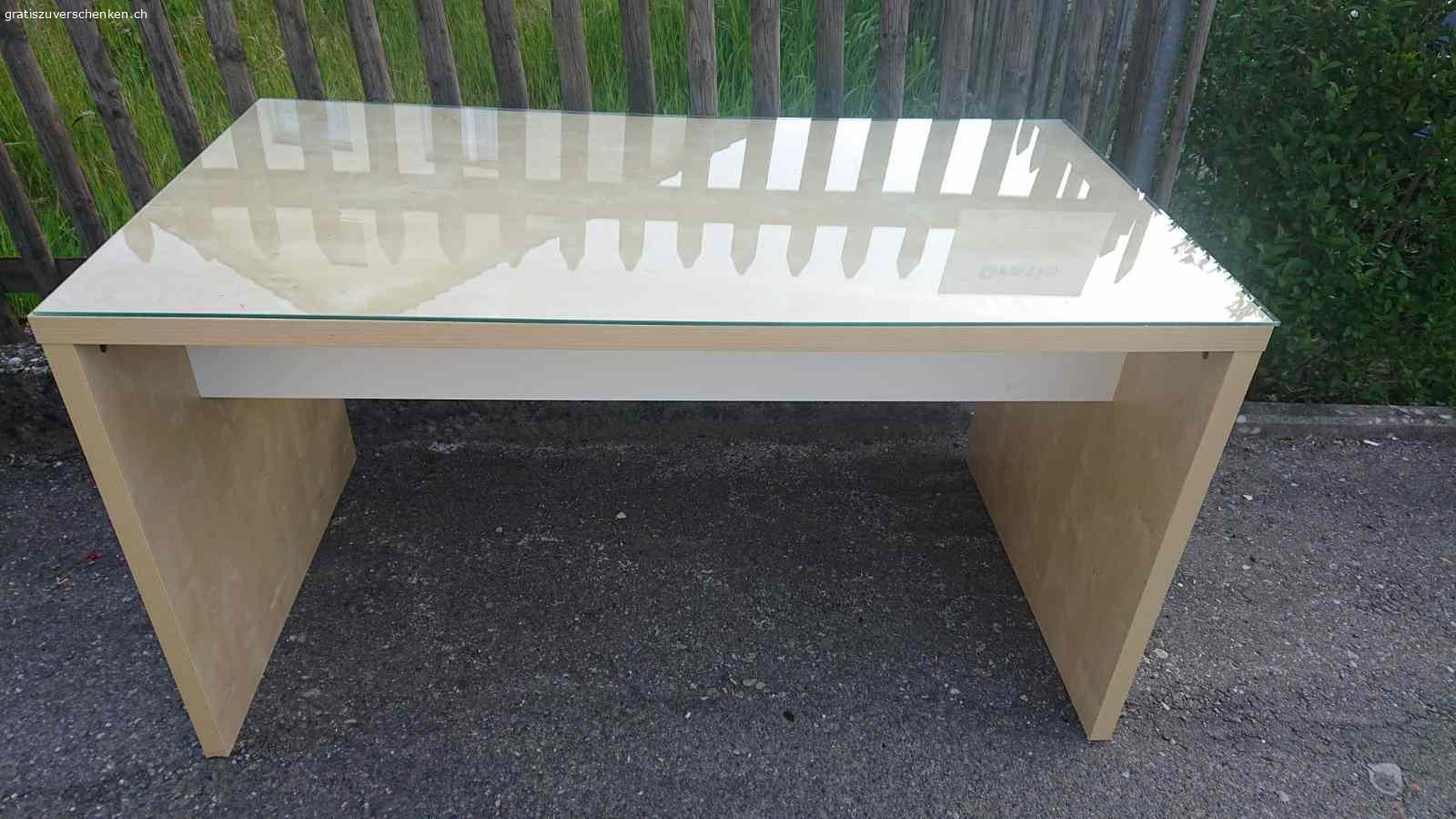 Schreibtisch mit Glasplatte. Aus laminiertem Holz. Länge: 140 cm, Breite: 75 cm, Höhe: 76 cm